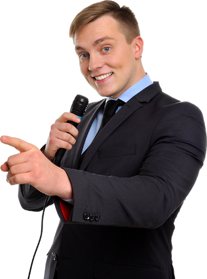 Comedian smiling and holding a microphone