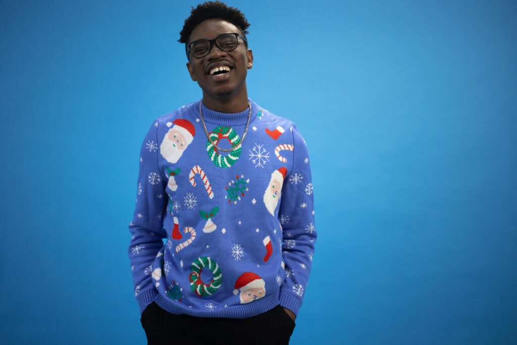 Ugly christmas sweater as party of your office christmas party games
