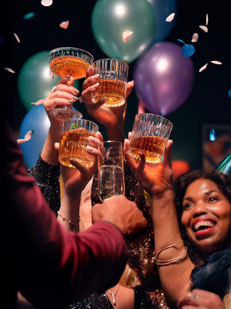 People cheersing at a holiday party