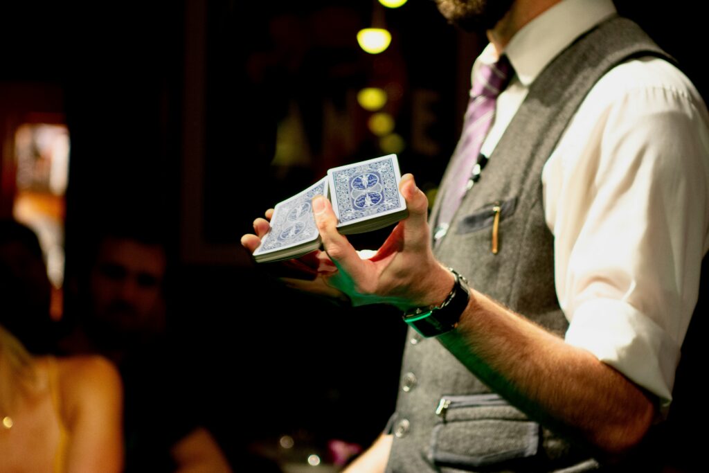 Close-up of a magician's hands holding a deck of cards